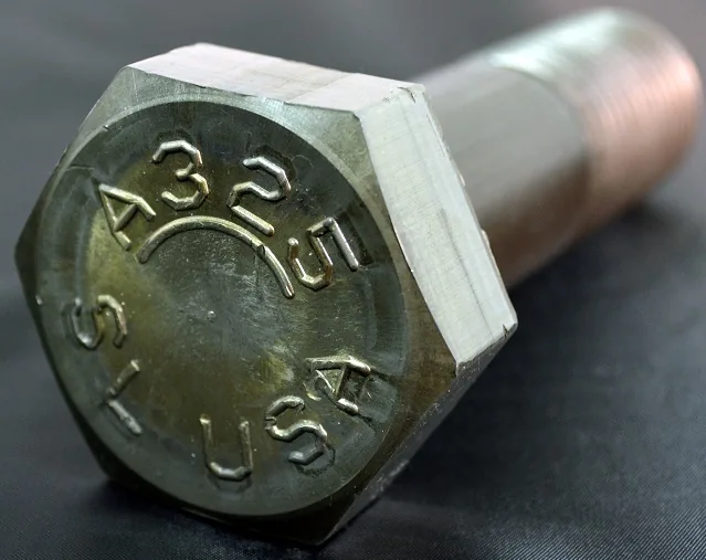 Close-up of an A325 heavy hex bolt head with USA marking