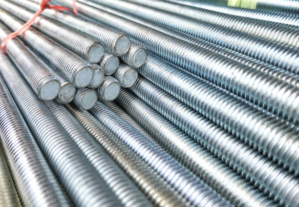 Close-up of bundled threaded steel rods